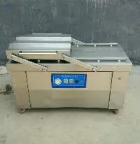Double chamber vacuum packing machine